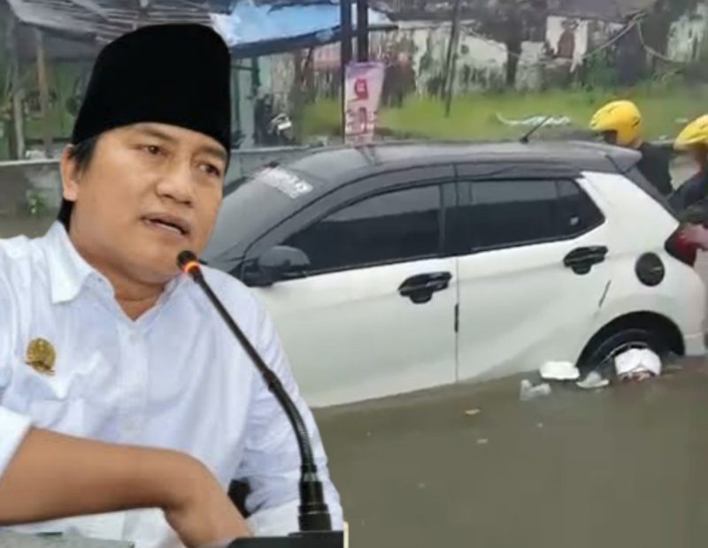 Anggota Komisi III DPRD Sumenep Ahmadi Yasid dengan Latar Belakang Mobil Mogok Karena Banjir